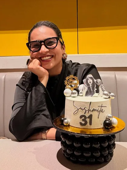 A solo shot with my special anchor-themed birthday cake. It represents my passion for my work, which is a huge part of who I am.