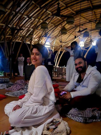 A candid moment of joy during our full moon kirtan. The sense of community and shared devotion creates an atmosphere of pure abundance and happiness.