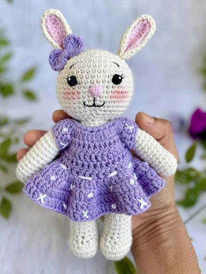 A lovely bunny in a purple dress with a custom initial "Q" on it. I made a similar one for my own daughter's birthday, and she absolutely adores it!