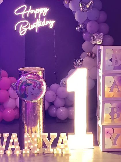 Detail shot of the marquee letters, number, and themed baby blocks.