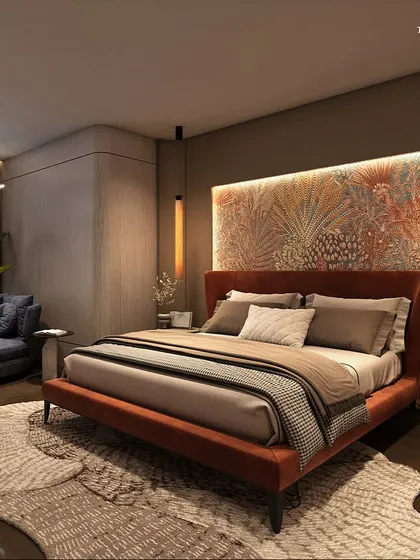 Another view of a guest suite at Palais Royale, designed to be a sanctuary in the sky. The room features a plush, oversized lounge chair by the window, offering a comfortable spot to enjoy the expansive city and sea views.
