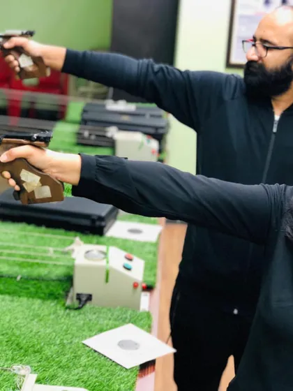 Paired practice helps shooters learn from each other while receiving individual guidance. Here, two of our students work on their air pistol technique side-by-side in our Noida facility.