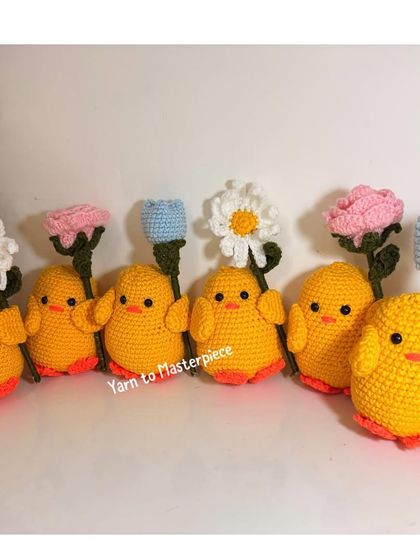 A whole group of my crochet chicks, holding different kinds of flowers like daisies, tulips, and roses.