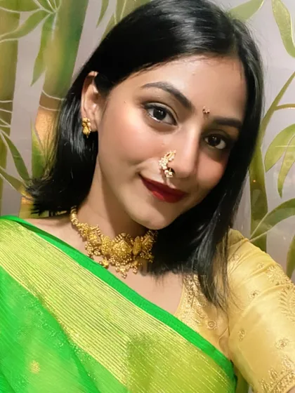 A close-up selfie from my Diwali celebration. I paired my green saree with traditional gold jewelry, including a temple-style necklace and a Maharashtrian nath, for an authentic festive look.