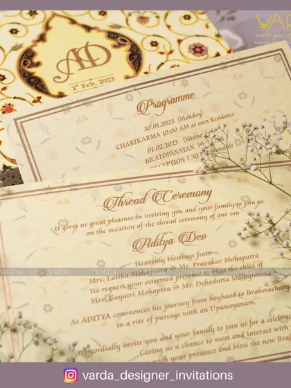 This classic thread ceremony invitation suite features elegant calligraphy and a traditional layout. The design includes a main invite and a separate programme card, ensuring guests have all the details for the sacred rite of passage.