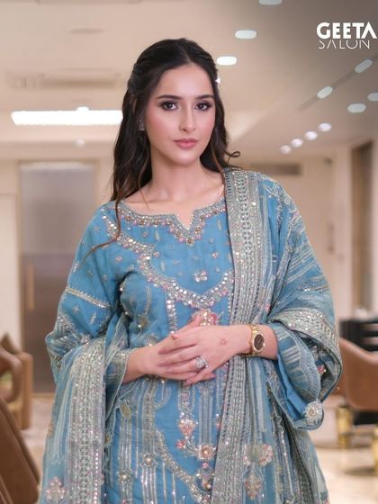 A closer look at Sadia Khateeb's makeup, featuring dewy skin and a hint of sparkle in the eyes.