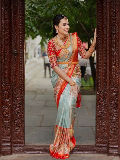 Another shot of the bride in the traditional doorway, highlighting the beautiful architecture and her timeless bridal style.