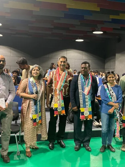 Honored with a sash alongside other dignitaries at the UID conclave in Gurugram.