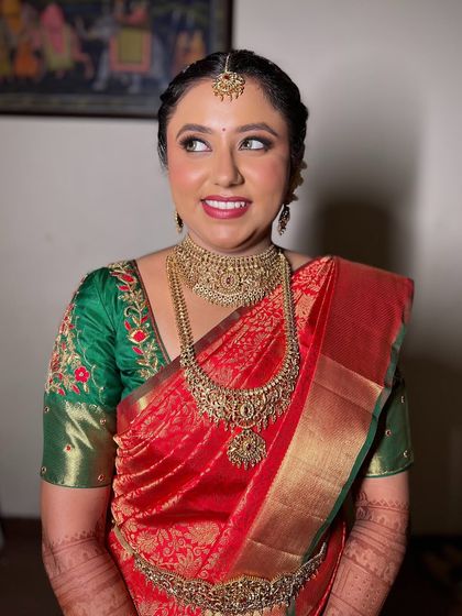 A happy and radiant portrait of Pooja, her smile lighting up the frame.