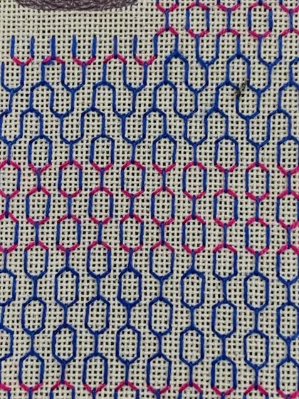 The phone insert partway through the stitching process. You can see how the pattern is built up row by row.