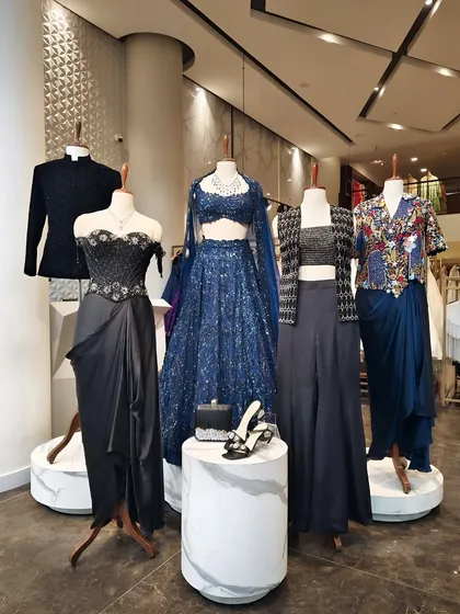 My in store curation for evening events. This display features ensembles in deep navy and black with touches of shimmer, for both him and her.