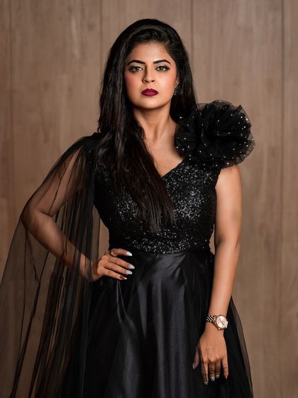 A powerful and confident shot of Mansi Joshi. This look is perfect for a red carpet event or a high-fashion photoshoot.