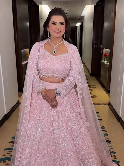 A full-length portrait of the gorgeous groom's mother. She looks absolutely radiant and ready for the wedding festivities.