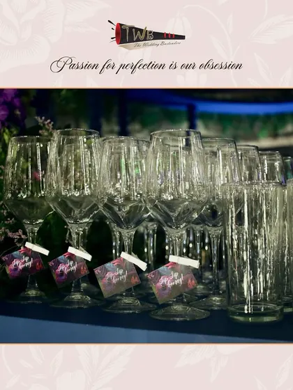 Elegant, custom-tagged glassware ready for service at a Sangeet night at Taj Lands End.