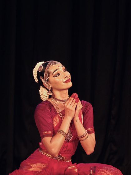 A moment of gratitude on stage. I am so thankful for my guru, the musicians, and the audience who make these performances possible.