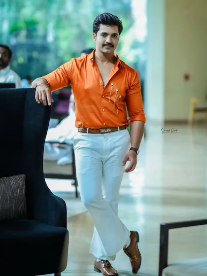 A full-length shot of Rohit Parshuram, looking sharp and ready for the awards party.