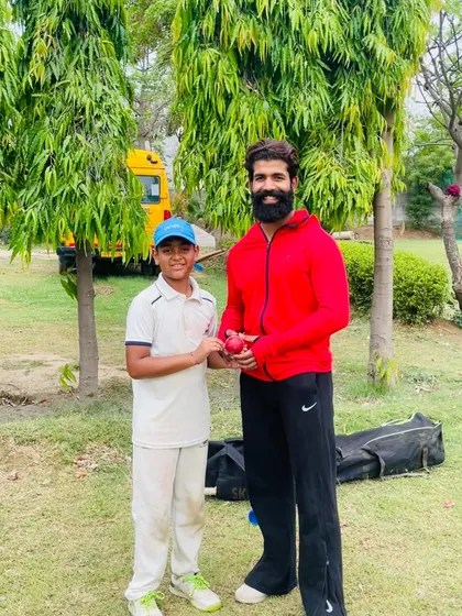 A coach presenting the match ball to a young performer from the SKCA Leopards U-10 team. We believe in encouraging talent from the very beginning.