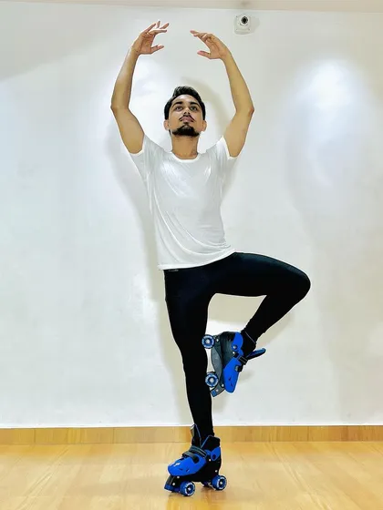 I also offer unique classes like artistic skating. Here, I'm demonstrating how we blend the grace of ballet with the dynamic movement of roller skating to create a fun and challenging workout.