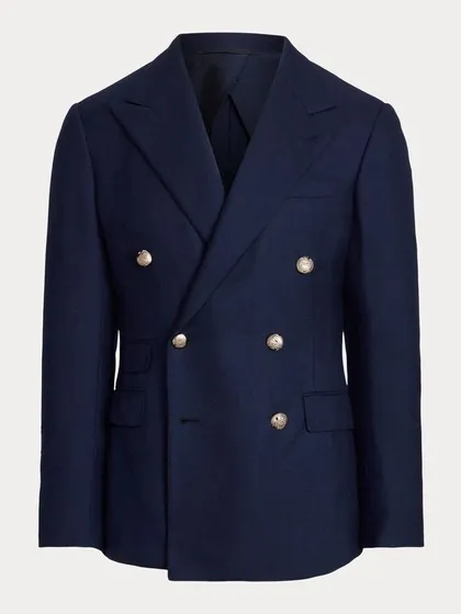 A classic navy double-breasted blazer with gold buttons. This is a timeless piece that captures the spirit of the individual who wears it.