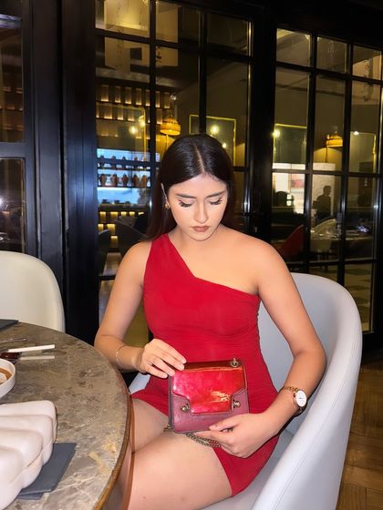 Looking into my bag, a candid moment during dinner.