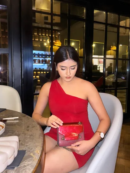 Looking into my bag, a candid moment during dinner.