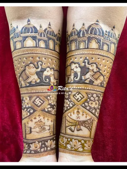 The back of the arms for the anniversary design, with grand elephants and temple architecture.