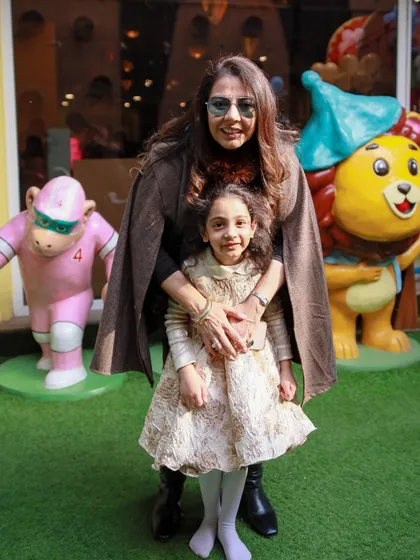 Posing with our friendly statues. We have fun photo opportunities for the whole family all around the play area.