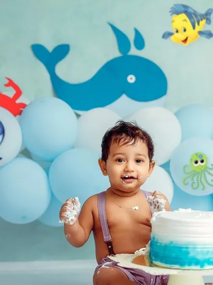 Another angle of our sea-themed cake smash, showing the joy and excitement of turning one.