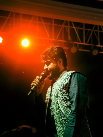 A powerful shot from an alumni meet performance, feeling the music under the stage lights.