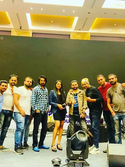 The whole team on stage after a successful gig in Mumbai. We pride ourselves on our professionalism and working closely with event organizers to ensure a smooth and impactful performance.