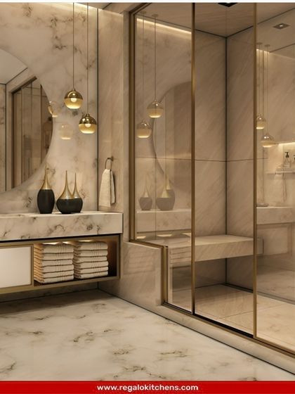 Pure luxury. This bathroom features floor-to-ceiling marble, gold fixtures, and a custom vanity with open towel storage. The pendant lights add a final touch of glamour.