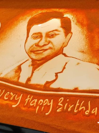 The final sand portrait for a 50th "Jubilee" birthday celebration for Mr. Prafull Khivsara of Malpani Group. It's the perfect way to end a biographical show.