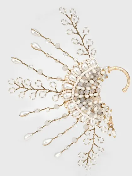 A new addition to our collection, this fan-like earcuff is made with pearls and crystals for a truly unique design.
