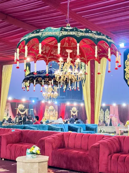 A close-up of the unique umbrella chandeliers, which combine traditional Rajasthani design with the elegance of a classic chandelier.