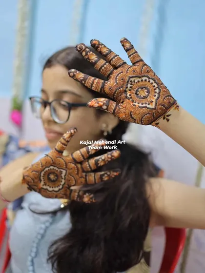 A lovely shot of a young guest showing off her matching mandala designs. We ensure everyone, no matter their age, gets a design they love.