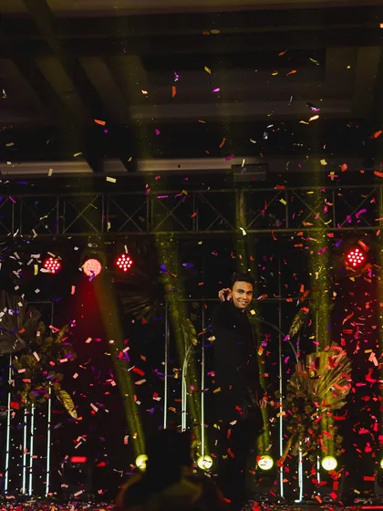 A shower of confetti marks the grand finale of the groom's spectacular solo performance.
