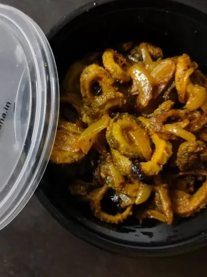 Our Karele ki Sabji, neatly packed in a container. We ensure that even the simplest dishes are prepared and delivered with the utmost care and hygiene.