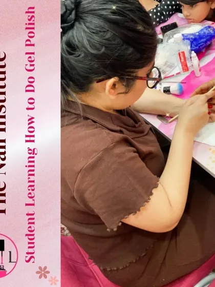 A student learns how to apply gel polish, a core skill taught in our comprehensive nail technician courses.