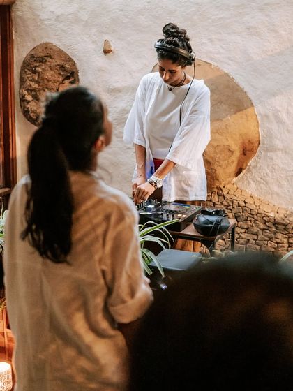 Music and good vibes are also part of the holistic experience at Natureville. Here is my partner, Mahalakshmi, who is a sound therapist, DJing at one of our community gatherings, creating a healing and joyful atmosphere.