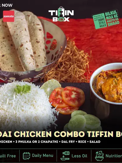 Spice up your meal with our Kadai Chicken Combo Tiffin Box. This meal features spicy Kadai Chicken, Dal Fry, rice, salad, and your choice of phulka or chapati for a complete and flavorful experience.