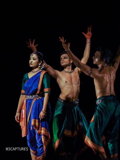 A powerful pose from 'Nagamandala'. The physical strength and control required for such moments are a result of rigorous training in the Bharatanatyam technique.