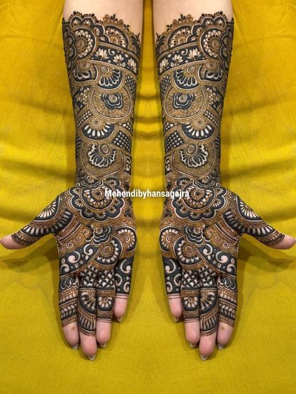 A throwback to one of my earlier designs, showcasing the timeless appeal of intricate, full-coverage mehendi. The bold, dark patterns create a stunning contrast and a truly royal feel.