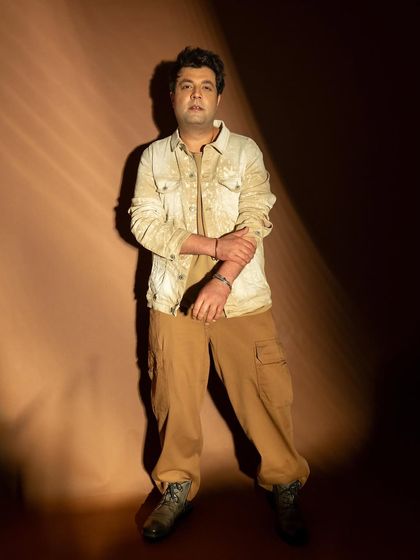 A more centered and direct pose from the same session, conveying a confident and straightforward attitude.