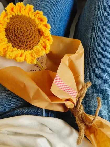 A casual shot of my wrapped crochet sunflower. It's the perfect little something to brighten up your day.