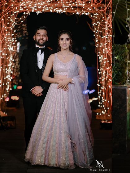 A classic full-length portrait of the couple on their engagement night.