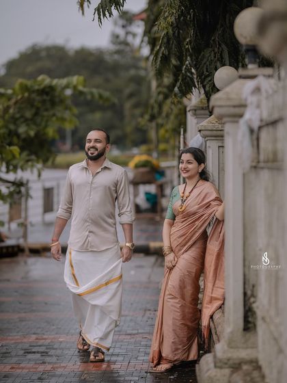 A relaxed moment, leaning against a wall on a city street. This has a very cool and casual vibe.