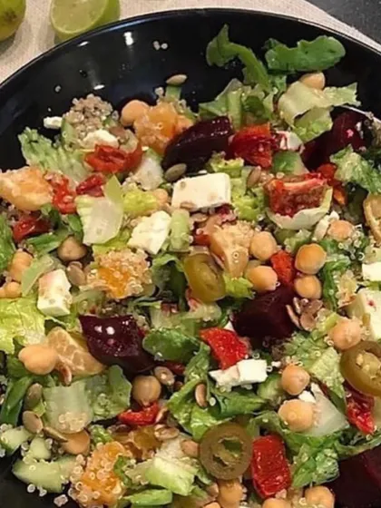 This summer salad is loaded with nutrition. It combines lettuce, spinach, paneer, chickpeas, and quinoa with a simple lemon and olive oil dressing. Salads are a great way to get a variety of vegetables, proteins, and healthy fats in one bowl.