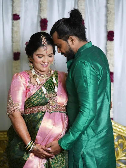 A sweet, candid moment. The makeup is soft and romantic, perfect for capturing these precious memories.