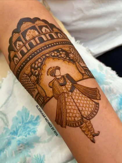 The start of a groom portrait, showing the groom in his royal wedding attire against an architectural backdrop.