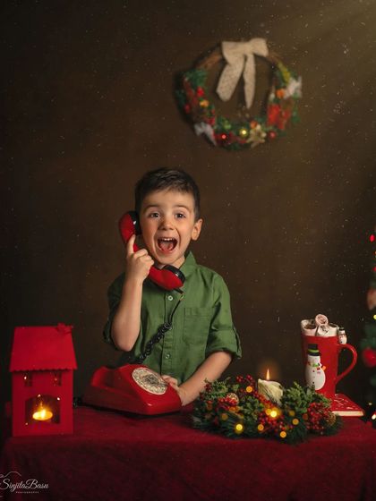 "Santa is on the line, Mama!" The sheer excitement on this little boy's face says it all. My Christmas sessions are designed to capture the pure, unadulterated belief in holiday magic.